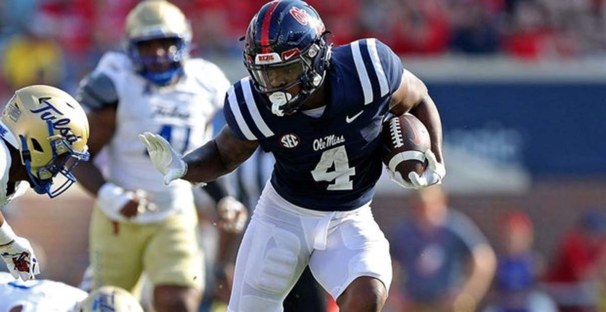 Ole Miss Rebels running back Quinshon Judkins on a rushing attempt during a college football game in the SEC.