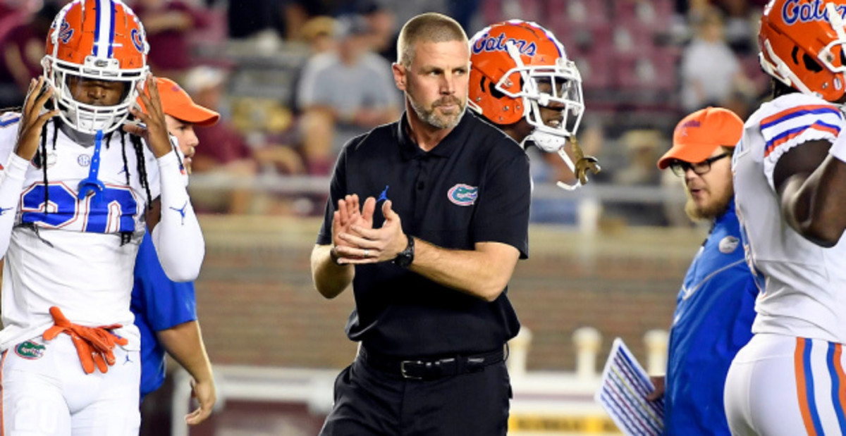 Florida Gators head coach Billy Napier on the sideline before kickoff at a college football game in the SEC.