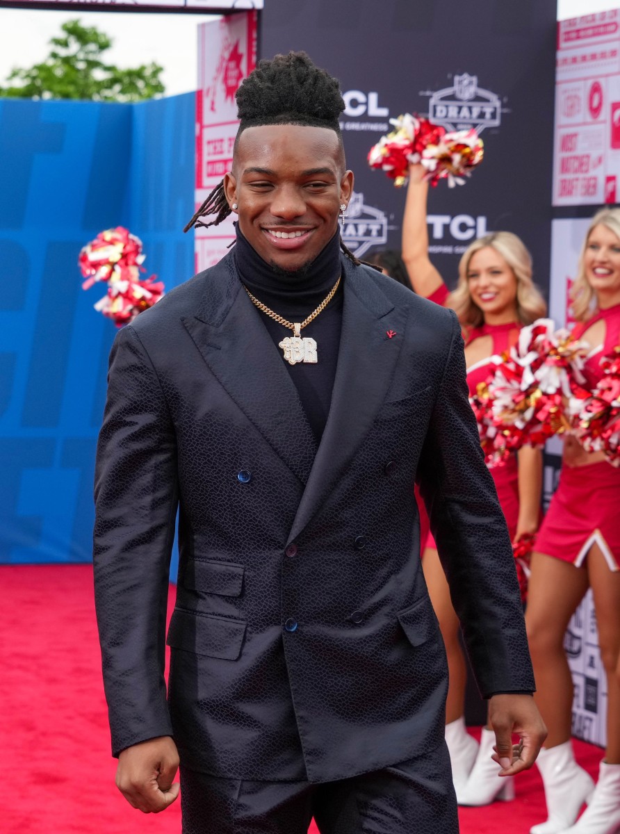 Texas running back Bijan Robinson walks on the NFL Draft Red Carpet before the first round of the 2023 NFL Draft at Union Station.