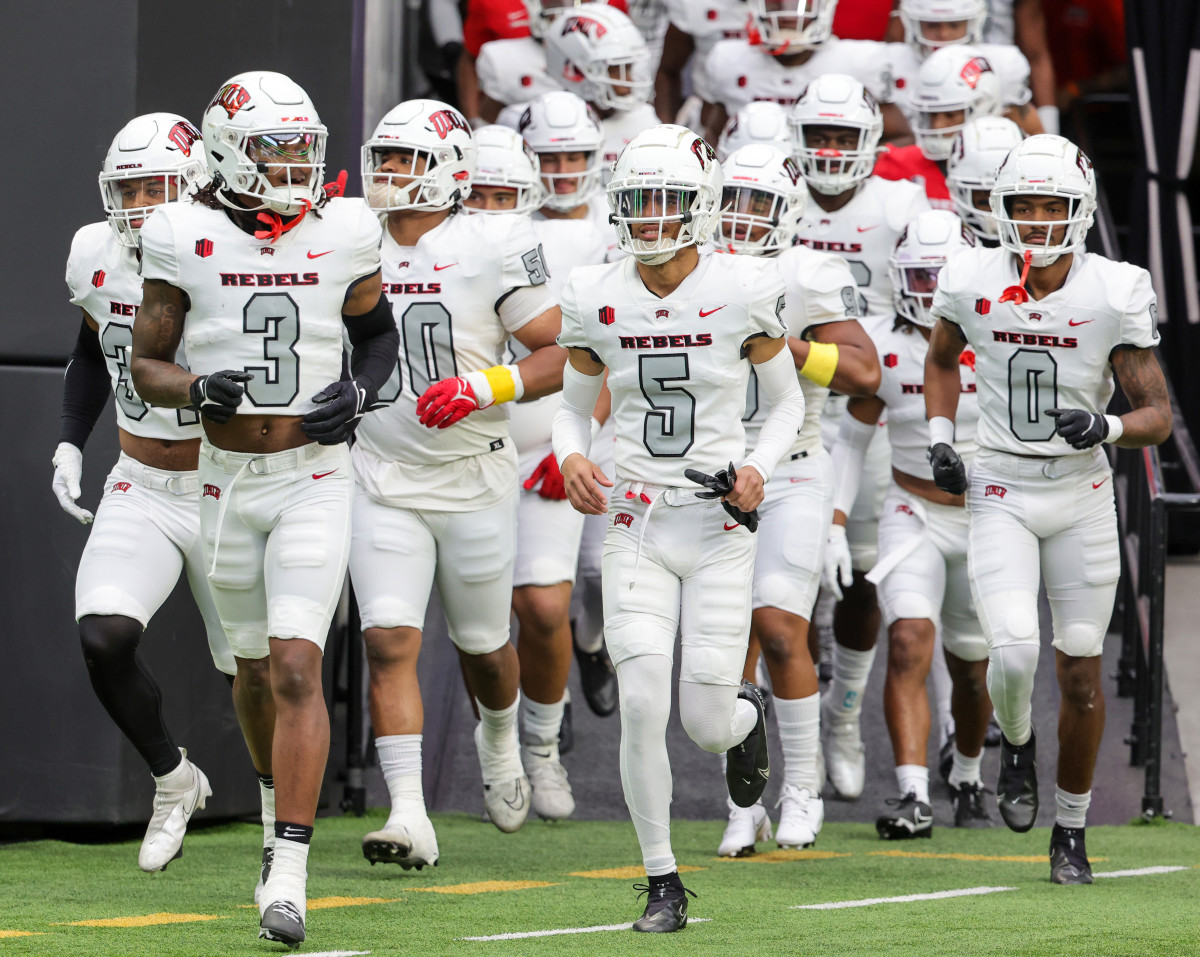LAS VEGAS, NEVADA - APRIL 08 UNLV Rebels runs onto the field  before the team's spring showcase scrimmage at Allegiant Stadium on April 08, 2023 in Las Vegas, Nevada. (Photo by Ethan Miller/Getty Images)