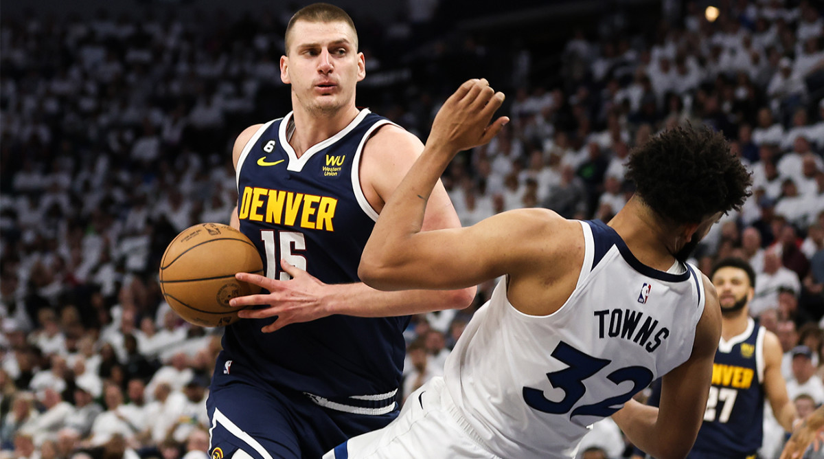 Nuggets’ Nikola Jokić blows by Timberwolves’ Karl Anthony-Towns.