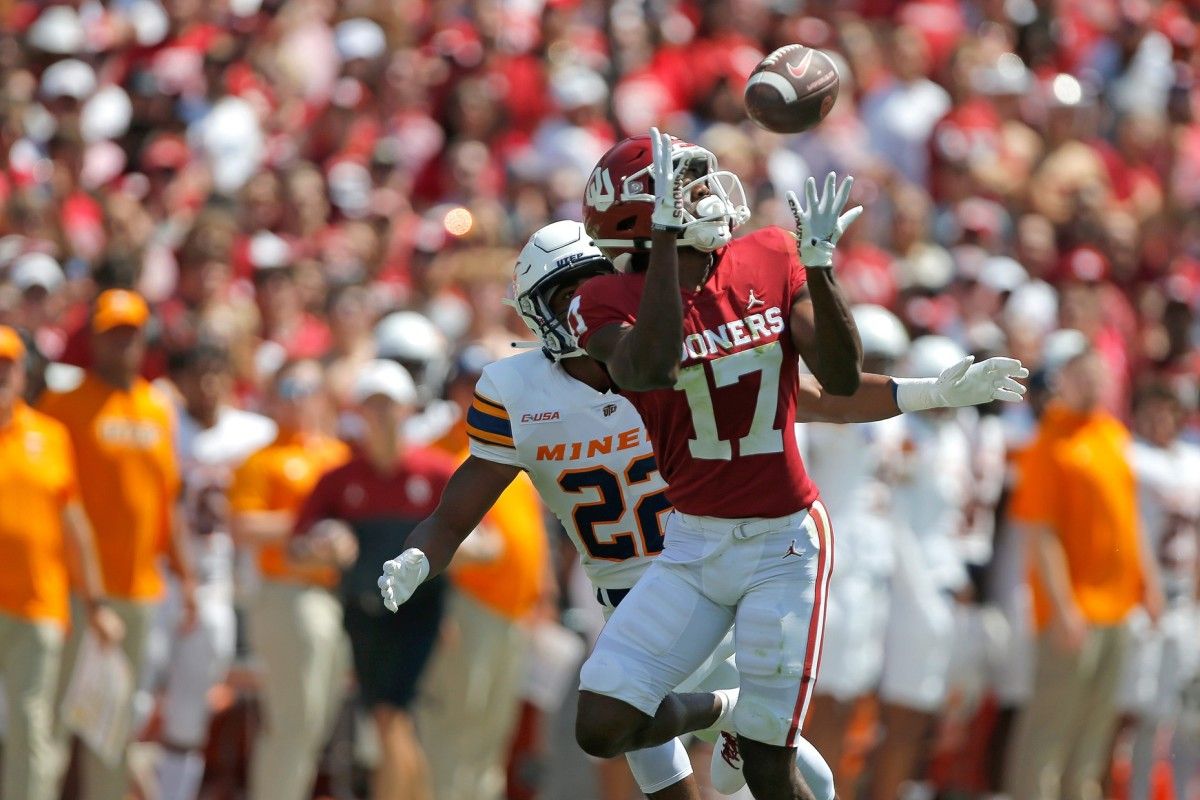 Oklahoma's Marvin Mims (17) catches a pass beside UTEP's Josiah Allen (22) during a college football game between the University of Oklahoma Sooners (OU) and the UTEP Miners at Gaylord Family - Oklahoma Memorial Stadium in Norman, Okla., Saturday, Sept. 3, 2022. Oklahoma won 45-13. Ou Vs Utep