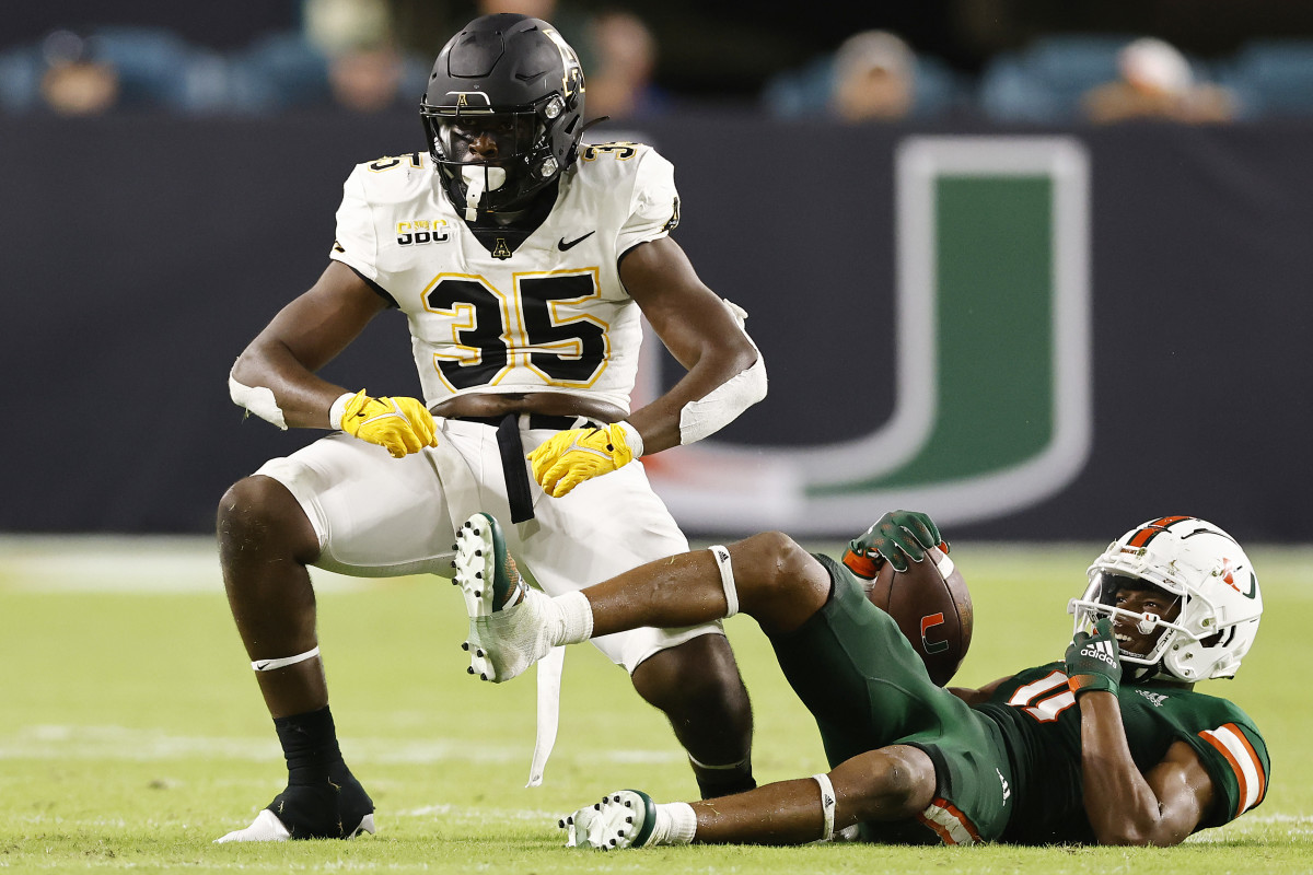 MIAMI GARDENS, FLORIDA - SEPTEMBER 11: Jalen McLeod #35 of the Appalachian State Mountaineers celebrates after tackling Charleston Rambo #11 of the Miami Hurricanes for a loss during the second half at Hard Rock Stadium on September 11, 2021 in Miami Gardens, Florida. (Photo by Michael Reaves/Getty Images)