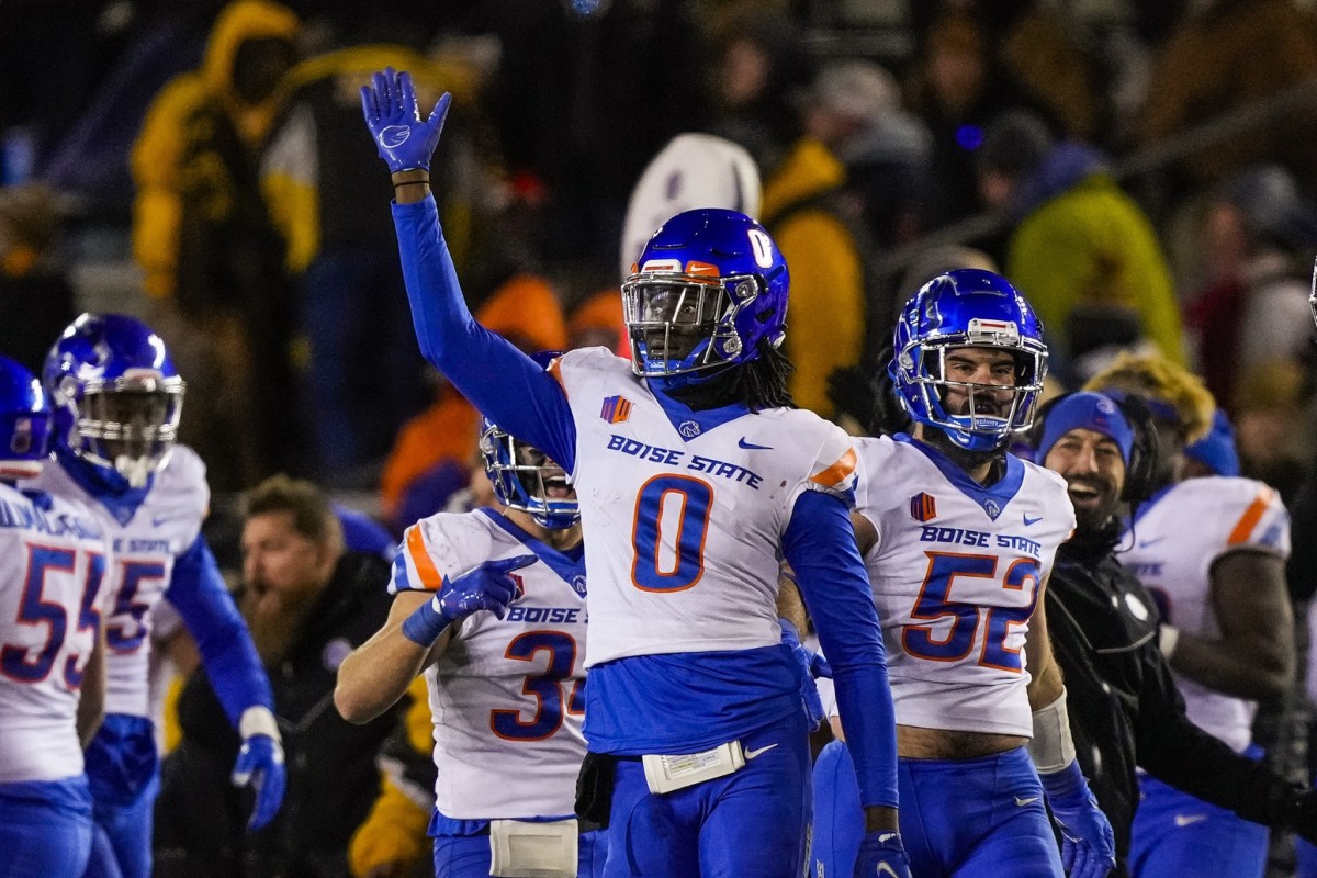 Boise State Broncos safety JL Skinner (0) makes an interception and celebrates against the Wyoming Cowboys during the fourth quarter at Jonah Field at War Memorial Stadium.