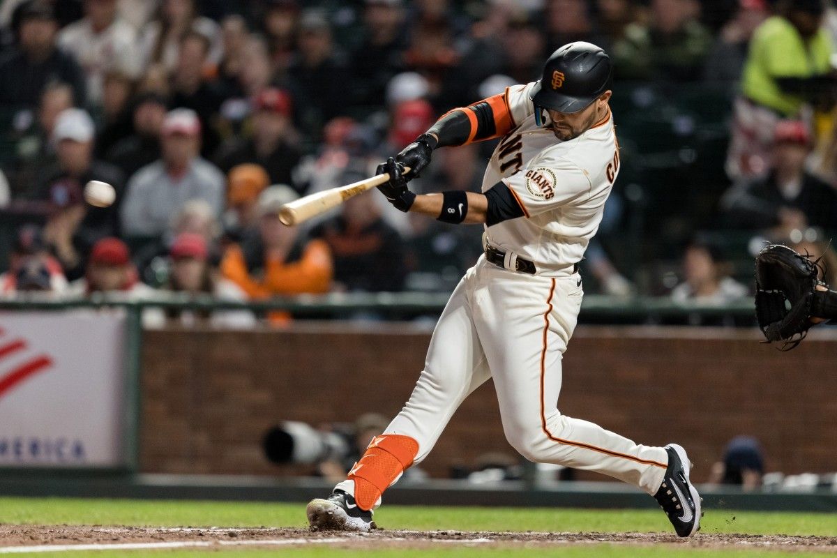 SF Giants slugger Michael Conforto hits a single at Oracle Park. (2023)