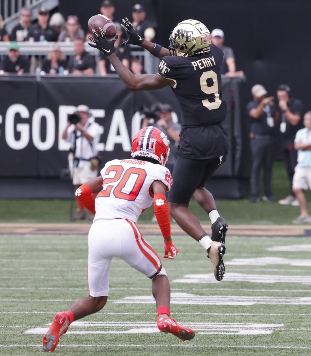 Wake Forest Demon Deacons receiver A.T. Perry (9) catches a pass in front of Clemson Tigers corner Nate Wiggins (20). Mandatory Credit: Reinhold Matay-USA TODAY Sports