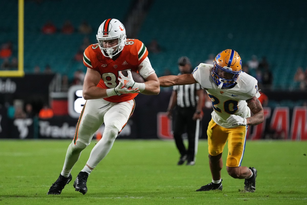 Miami Hurricanes tight end Will Mallory (85) after a catch against Pitt Panthers defensive back Javon McIntyre (20). Mandatory Credit: Jasen Vinlove-USA TODAY