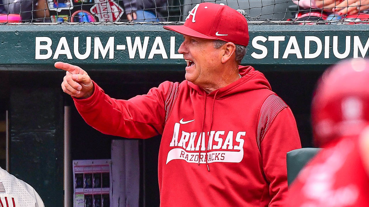 Razorbacks coach Dave Van Horn walks off the field during a pitching change against Texas A&M on Saturday