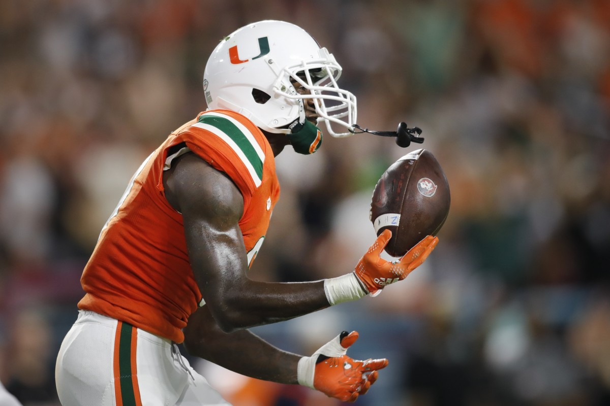 Nov 5, 2022; Miami Gardens, Florida, USA; Miami Hurricanes cornerback DJ Ivey (8) celebrates after intercepting a pass intended to Florida State Seminoles wide receiver Ontaria Wilson (not pictured) during the second quarter at Hard Rock Stadium. Mandatory Credit: Sam Navarro-USA TODAY Sports