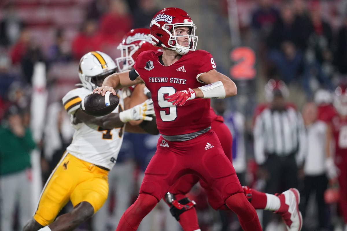 Jake Haener (9) throws a pass against the Wyoming Cowboys