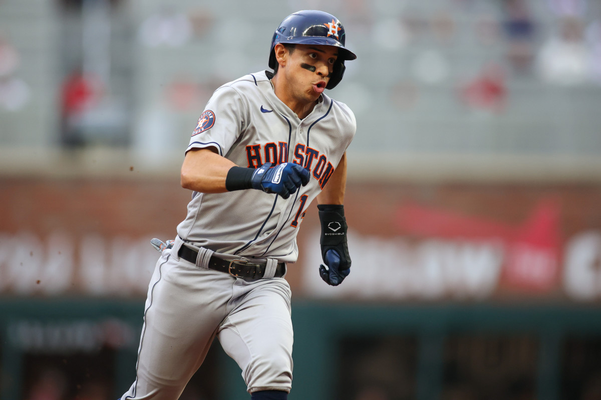 Houston Astros second baseman Mauricio Dubón scores a run against Atlanta. (2023)