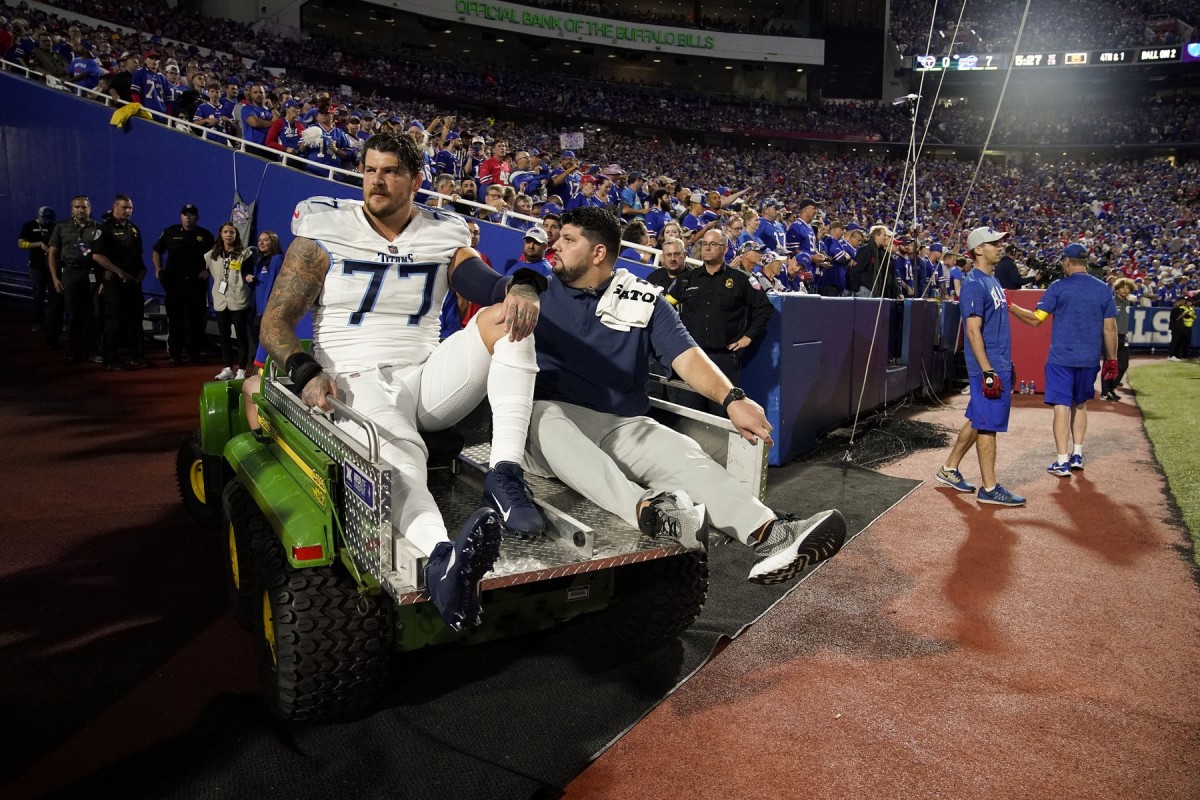 Lewan leaving the field in Buffalo following his injury that ended his 2022 season. 