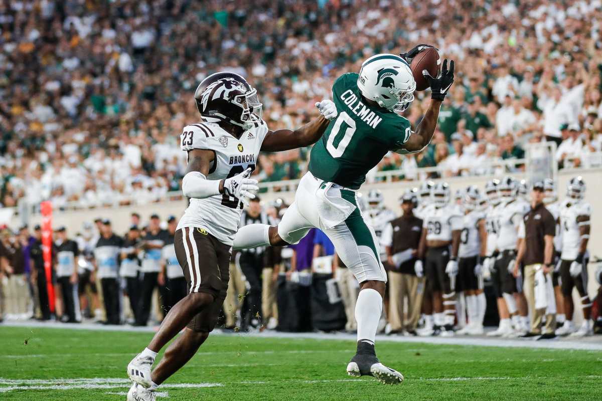Michigan State wide receiver Keon Coleman (0) makes a catch against Western Michigan cornerback Dorian Jackson (23) during the first half at Spartan Stadium in East Lansing on Friday, Sept. 2, 2022.