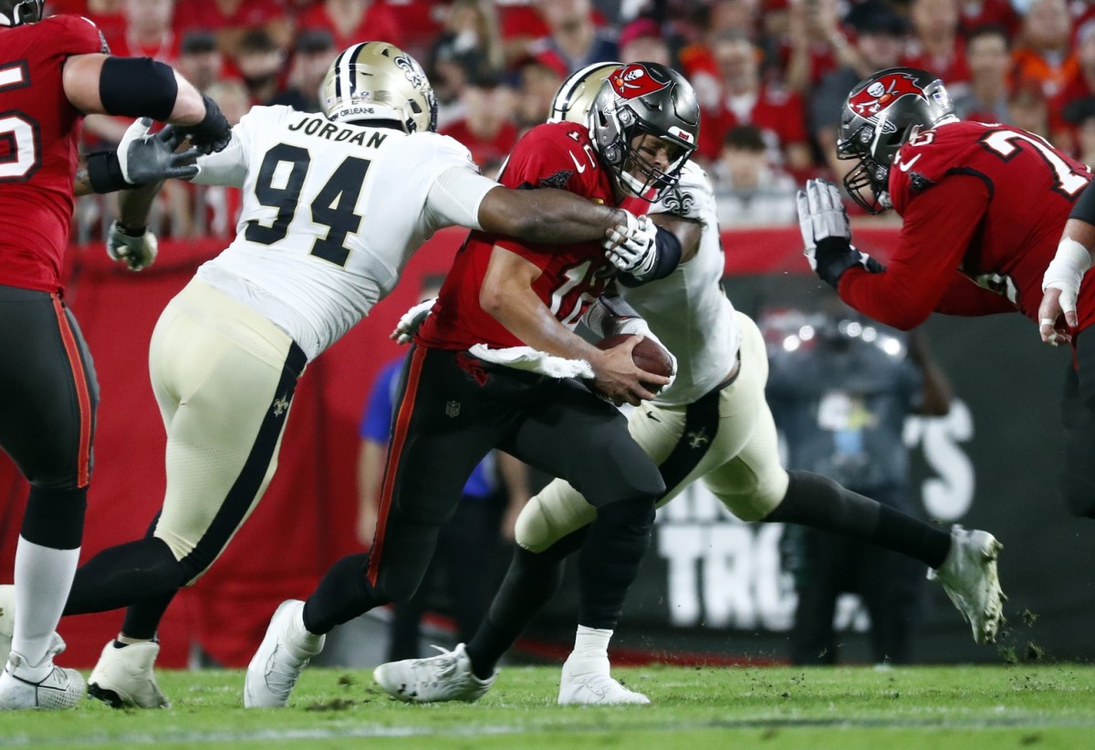 Dec 19, 2021; New Orleans Saints defensive end Cameron Jordan (94) sacks Tampa Bay Buccaneers quarterback Tom Brady (12). Mandatory Credit: Kim Klement-USA TODAY Sports