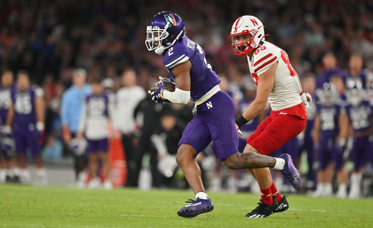 Nov 5, 2022; Evanston, Illinois, USA; Northwestern Wildcats defensive back Cameron Mitchell (2) celebrates a pass break up against Ohio State Buckeyes tight end Gee Scott Jr. (88) during the first half of the NCAA football game at Ryan Field. Mandatory Credit: Adam Cairns-The Columbus Dispatch Ncaa Football Ohio State Buckeyes At Northwestern Wildcats