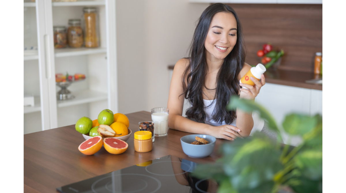 what-is-a-prebiotic-woman-with-fruits-holding-nondescript-bottle