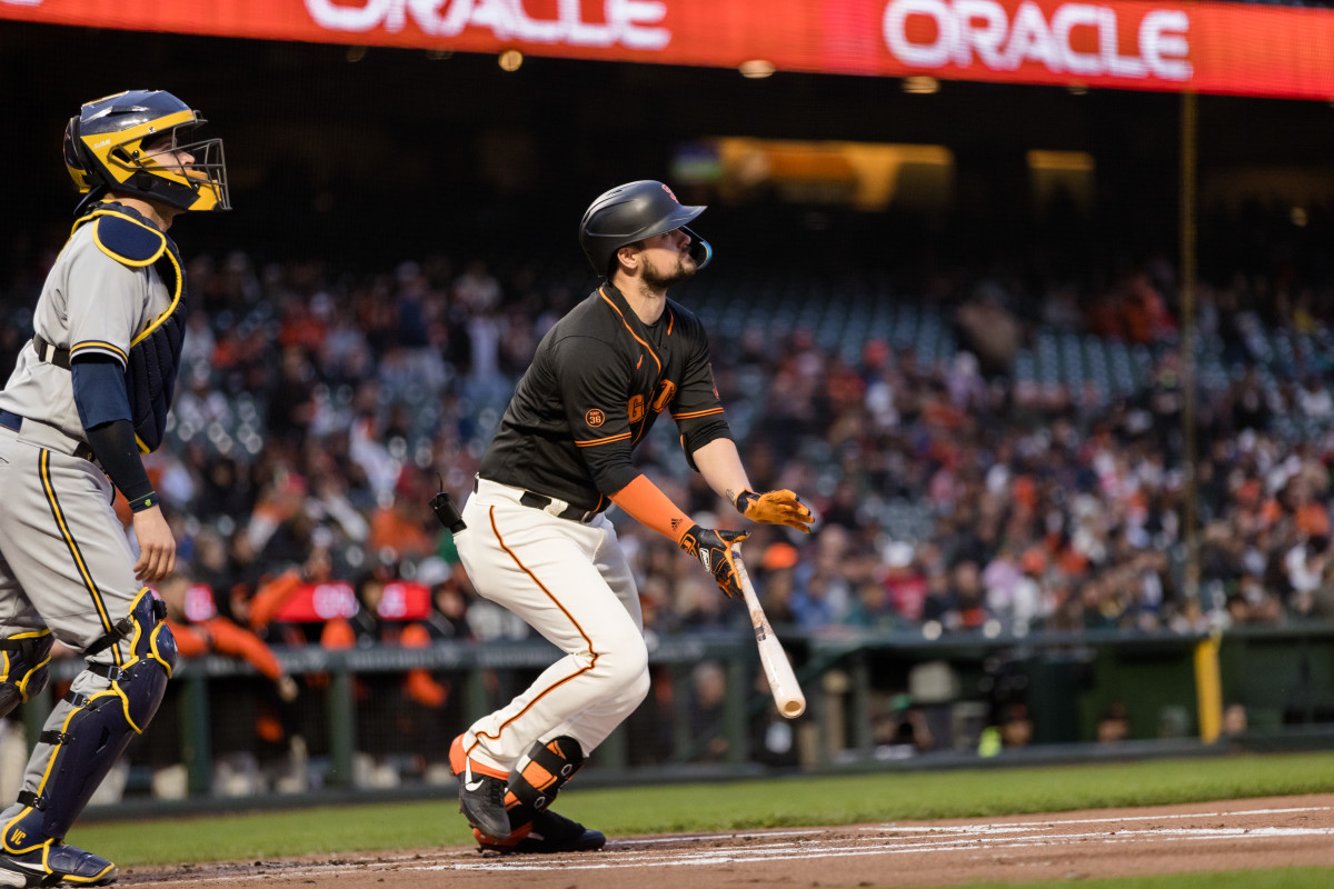 SF Giants third baseman J.D. Davis hits a two-run home run during the first inning against the Brewers on May 5, 2023.