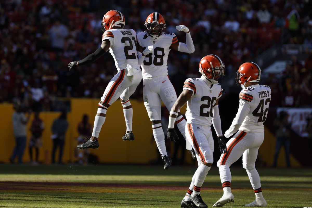 Jan 1, 2023; Landover, Maryland, USA; Cleveland Browns cornerback Denzel Ward (21) celebrates with Cleveland Browns cornerback A.J. Green (38) after intercepting a pass against the Washington Commanders during the first quarter at FedExField. Mandatory Credit: Geoff Burke-USA TODAY Sports