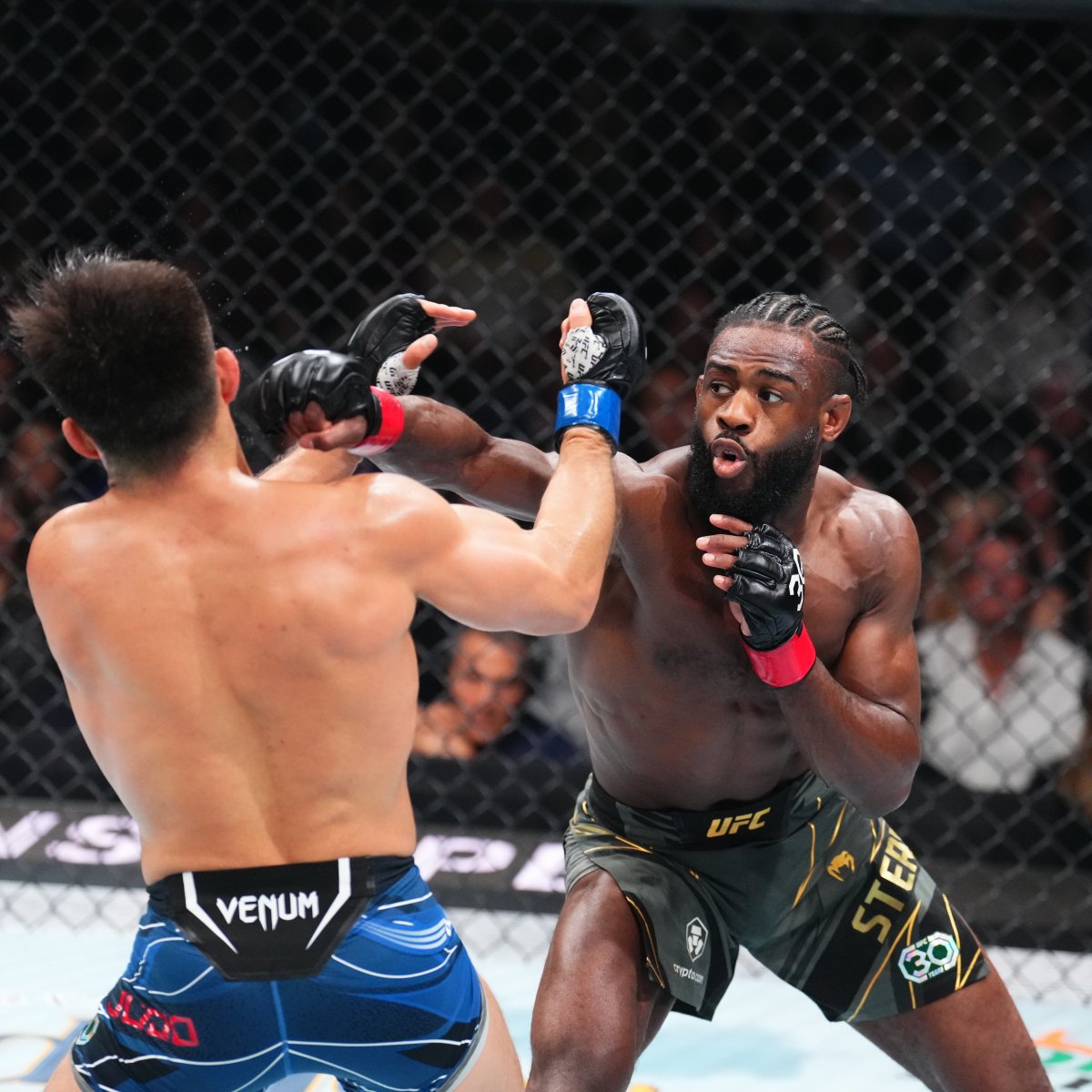 Aljamain Sterling lands a punch on Henry Cejudo at UFC 288 in Newark, New Jersey
