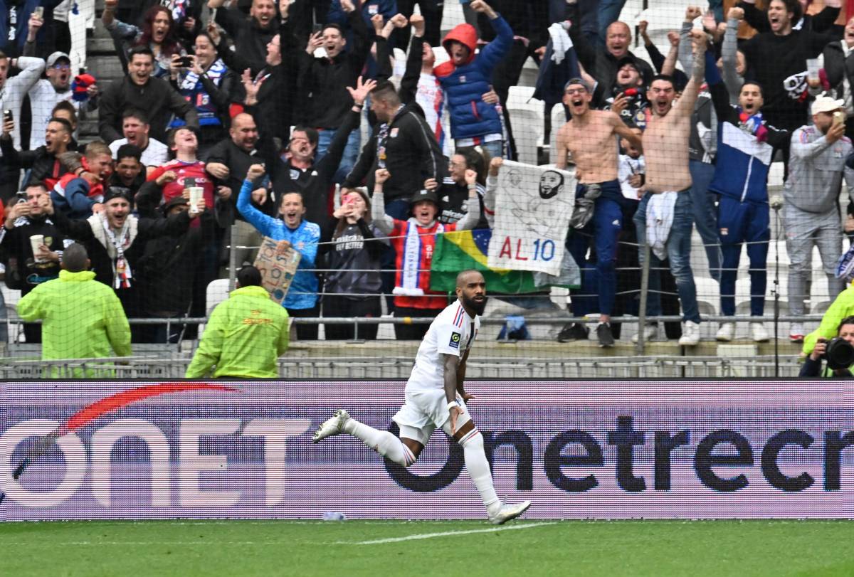 Alexandre Lacazette pictured celebrating after scoring his fourth goal of the game in Lyon's 5-4 win over Montpellier in May 2023