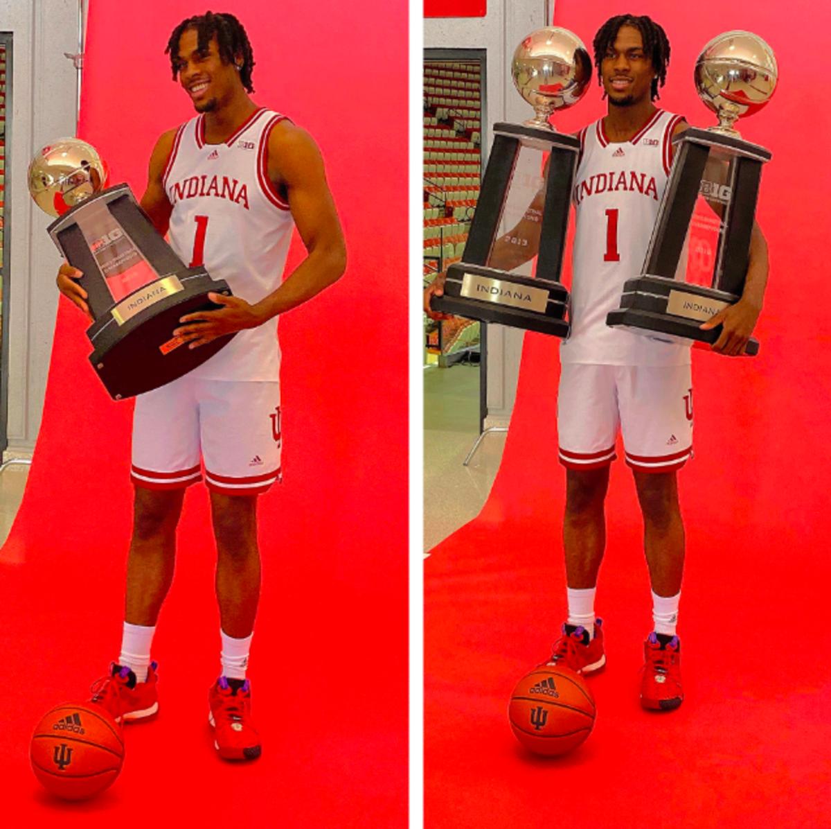 Mackenzie Mgbako poses with Big Ten championship trophies during his visit to Indiana. 