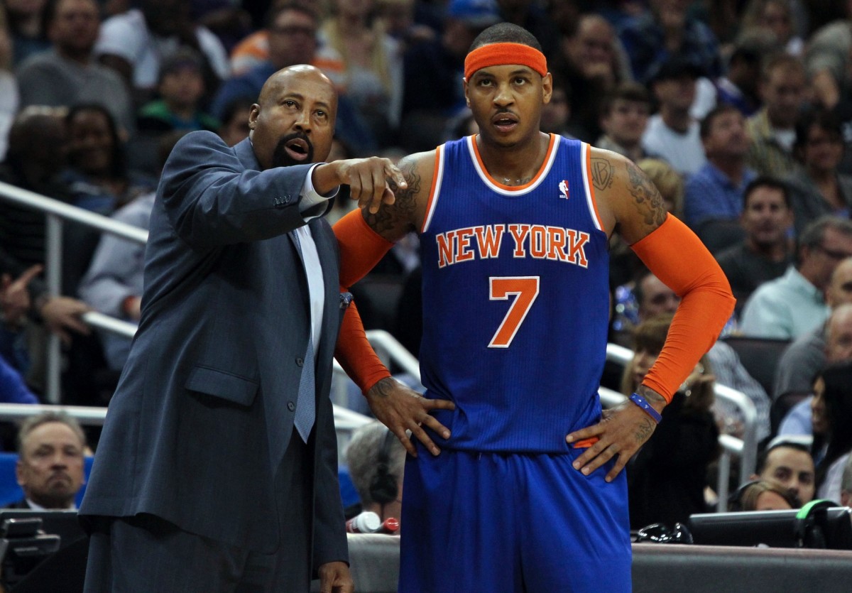 New York Knicks head coach Mike Woodson talks with small forward Carmelo Anthony (7) during the second quarter at Amway Center.