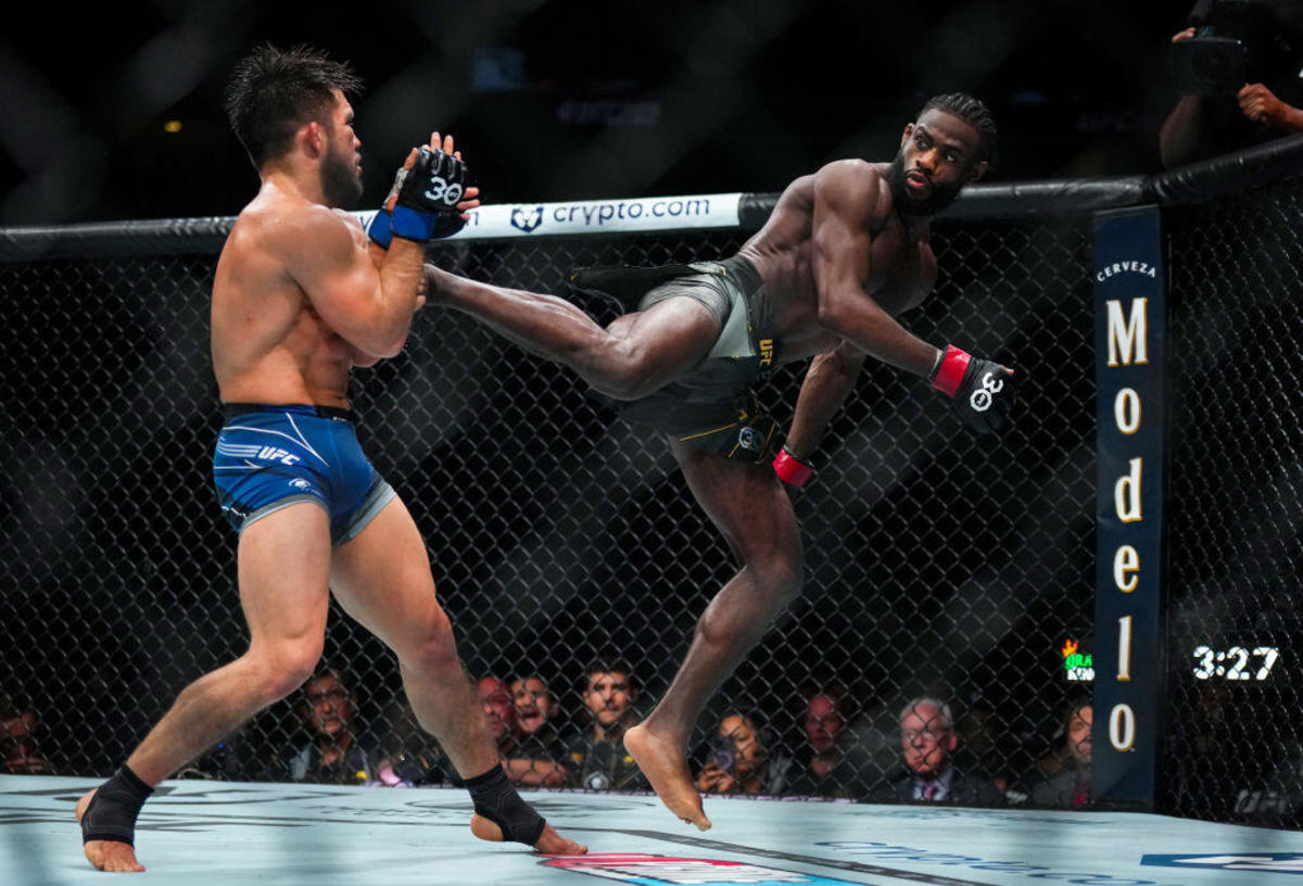 Aljamain Sterling throws a kick at Henry Cejudo during their UFC 288 title fight