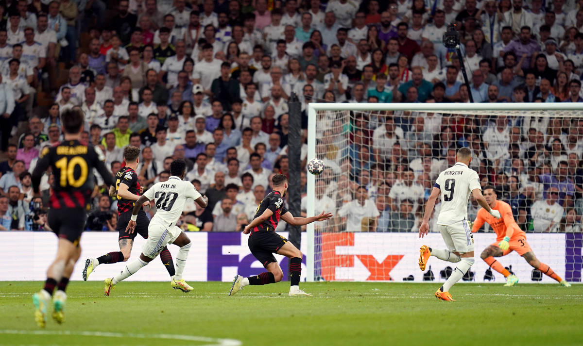 Vinicius Junior pictured (third from left) moments after unleashing a powerful shot to score for Real Madrid against Manchester City at the Bernabeu in May 2023