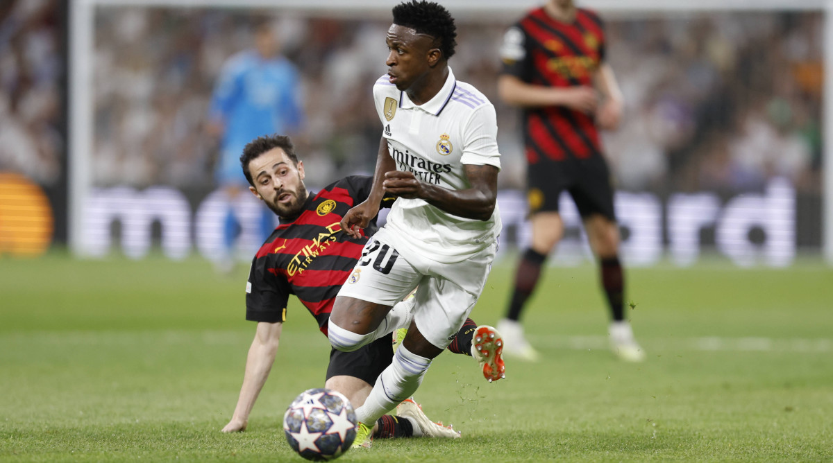 Vinicius dribbling against Man City.