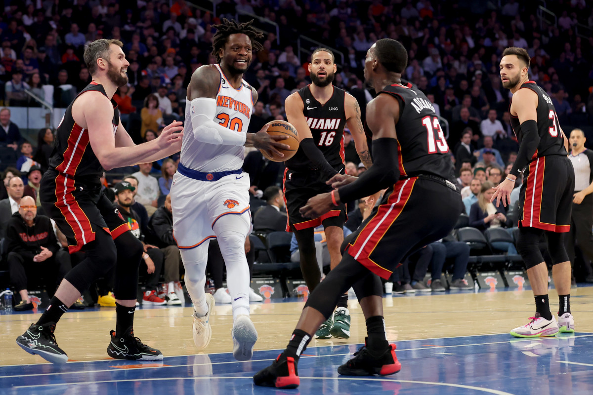 The Knicks are swarmed by Heat defenders in the paint during an NBA playoff game.
