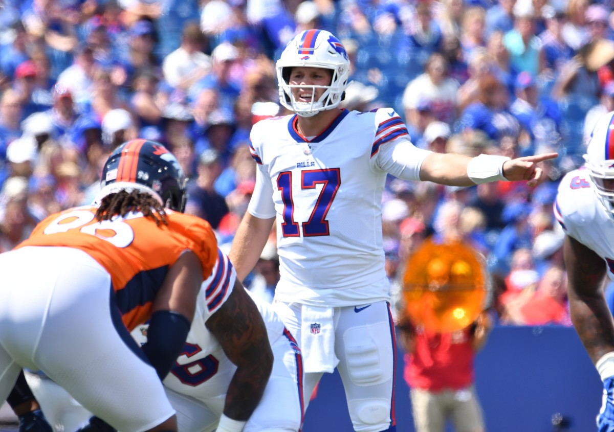 Buffalo Bills quarterback Josh Allen (17) at the line of scrimmage in the first quarter of a pre-season game against the Denver Broncos at Highmark Stadium.