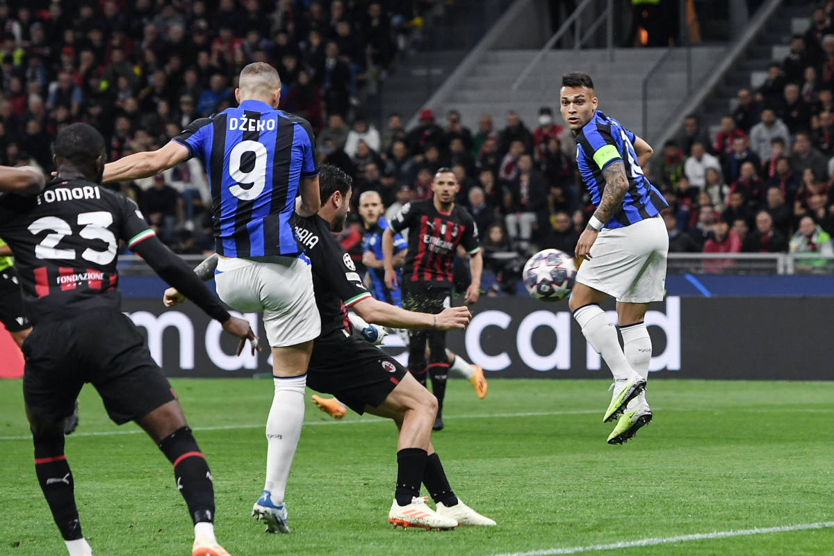 Inter Milan no.9 Edin Dzeko pictured volleying the ball to score against AC Milan in a Champions League semi-final first leg in May 2023