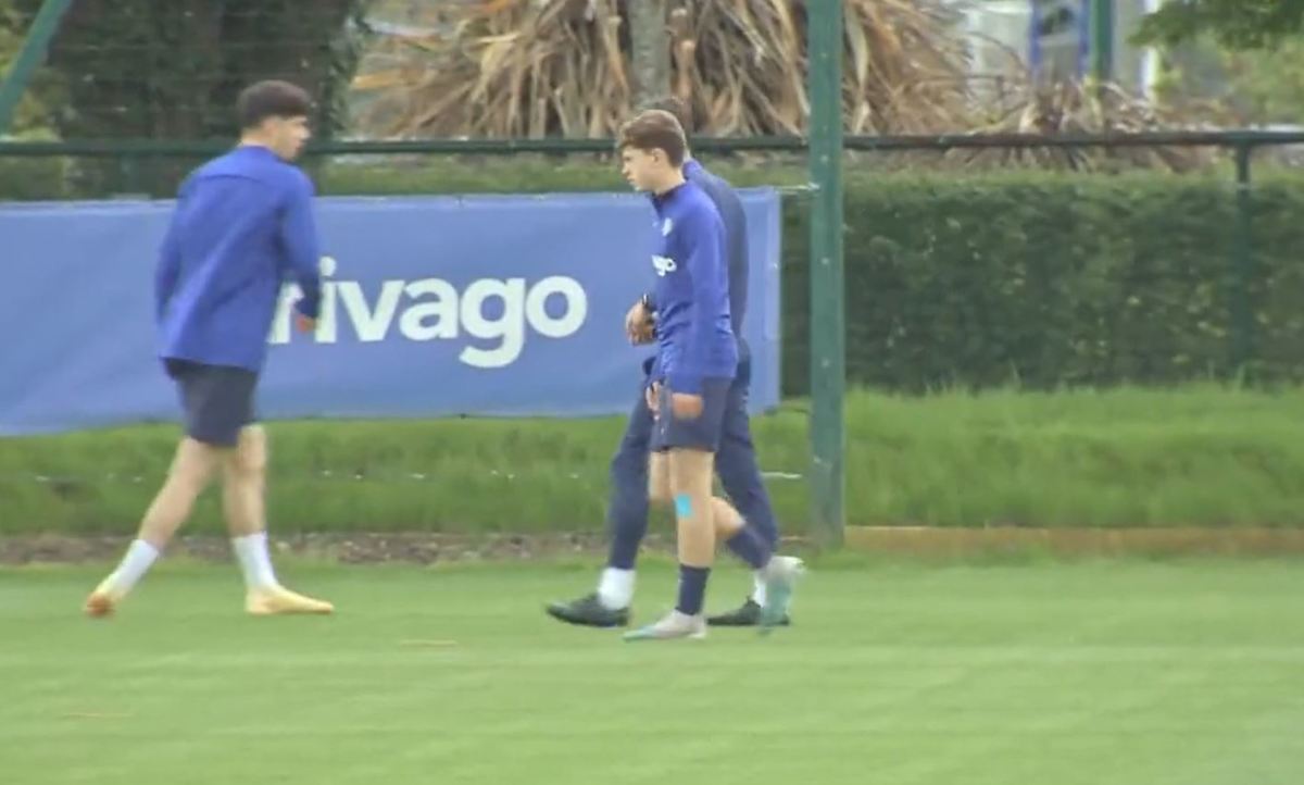Charlie Holland, 14, pictured (center) during a Chelsea first-team training session in May 2023
