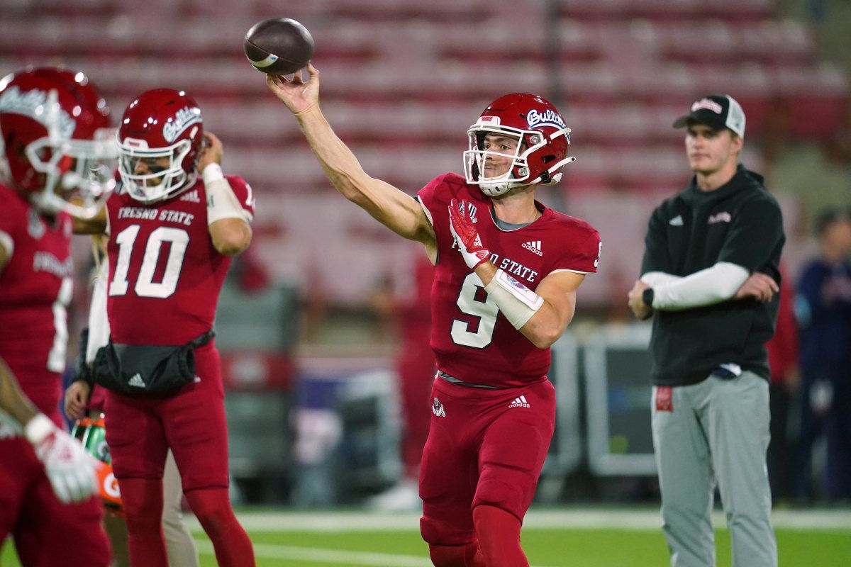 Fresno State Bulldogs quarterback Jake Haener (9) throws a pass before the start of the game against the Wyoming Cowboys
