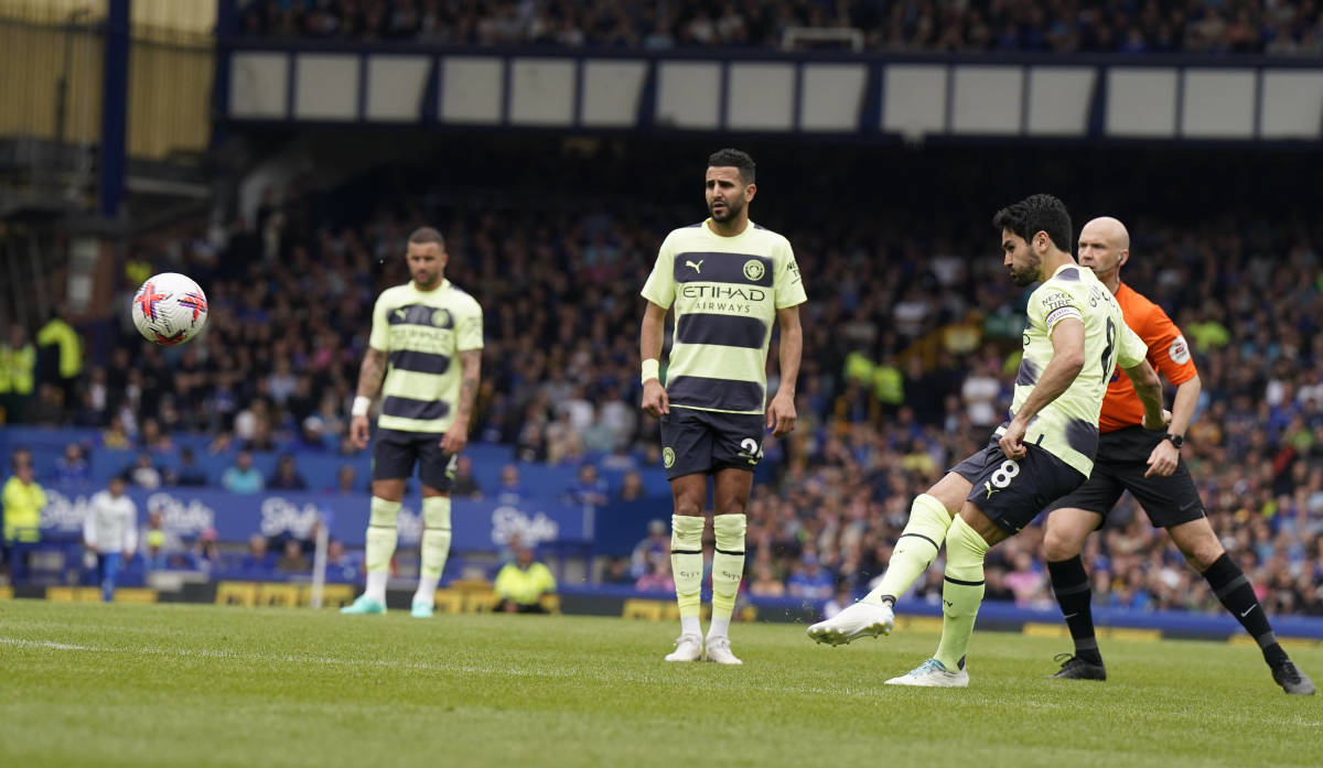Ilkay Gundogan pictured (right) scoring from a free-kick for Manchester City against Everton in May 2023