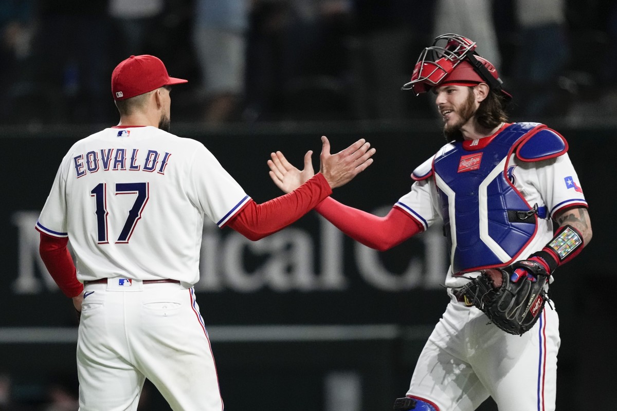 Texas Rangers starting pitcher Nathan Eovaldi (17) and catcher Jonah Heim (28) celebrate after defeating the New York Yankees at Globe Life Field. (Jim Cowsert-USA TODAY Sports)