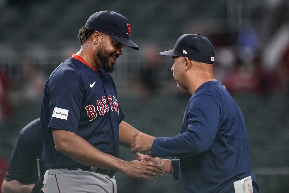 Boston Red Sox relief pitcher Kenley Jansen (74) reacts with manager Alex Cora (13) after recording his 400th career save against the Atlanta Braves at Truist Park. (Dale Zanine-USA TODAY Sports)