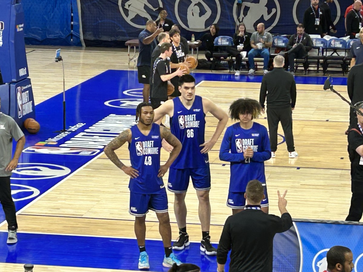 Purdue center Zach Edey waits his turn to do a drill during the NBA Draft Combine on Monday at Wintrust Arena in Chicago. He's pictured with Cam Whitmore (48) of Villanova and Anthony Black (right) of Arkansas. (Photo by Tom Brew)