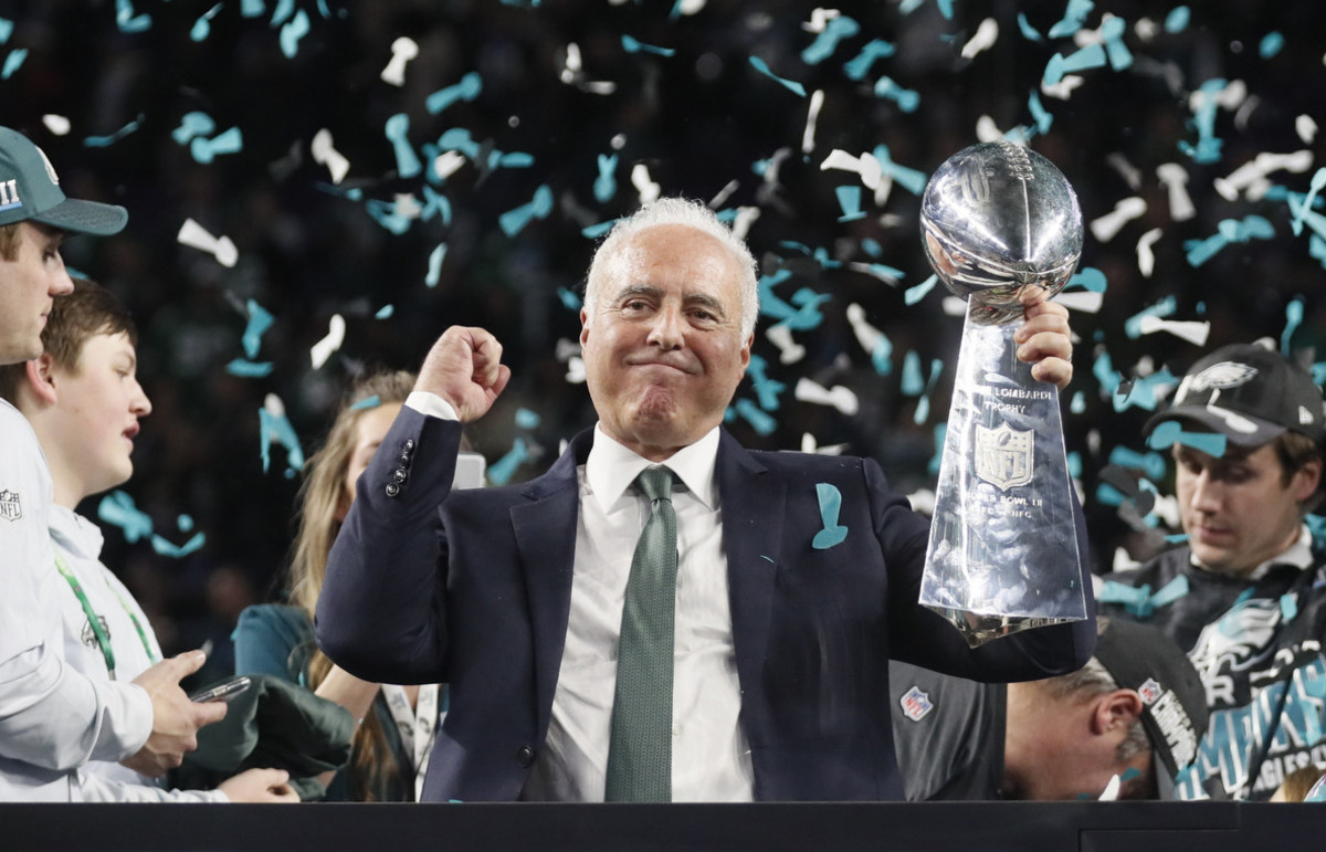 Eagles owner Jeff Lurie holds the Lombardi Trophy after Super Bowl LII