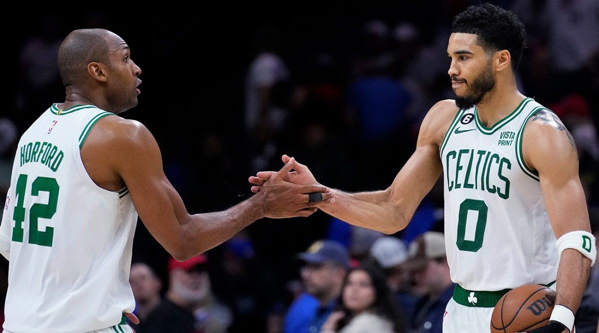 Celtics’ Al Horford and Jayson Tatum shake hands.