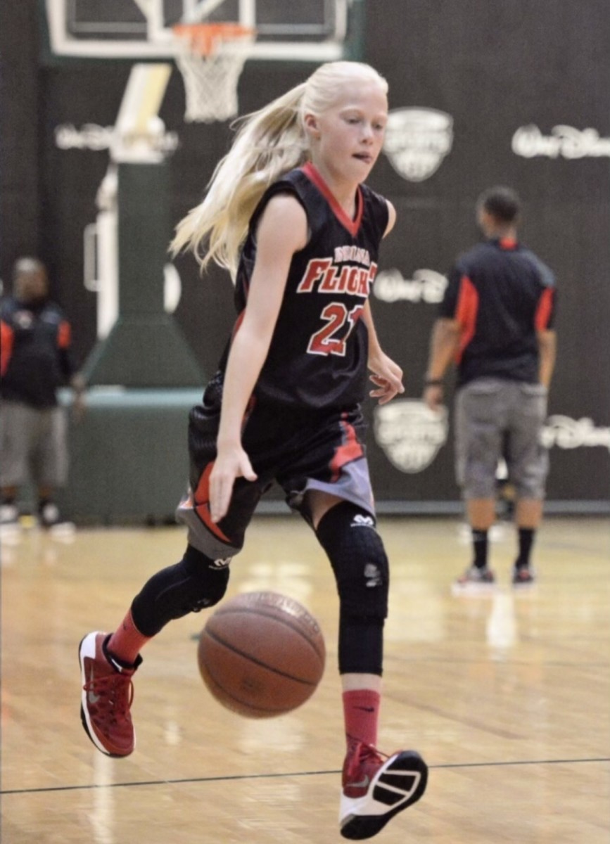 A young Faith Wiseman dribbles the ball down the court for the Indiana Flight.