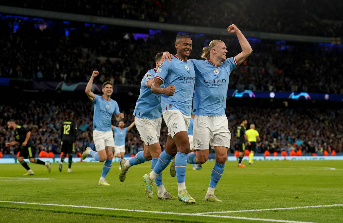 Players from Manchester City pictured celebrating during their 4-0 win over Real Madrid in the semi-finals of the Champions League in May 2023