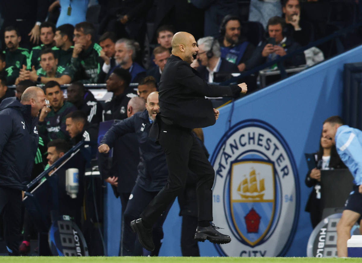 Pep Guardiola pictured celebrating during Manchester City's 4-0 victory over Real Madrid in May 2023 - his 100th Champions League win as a manager