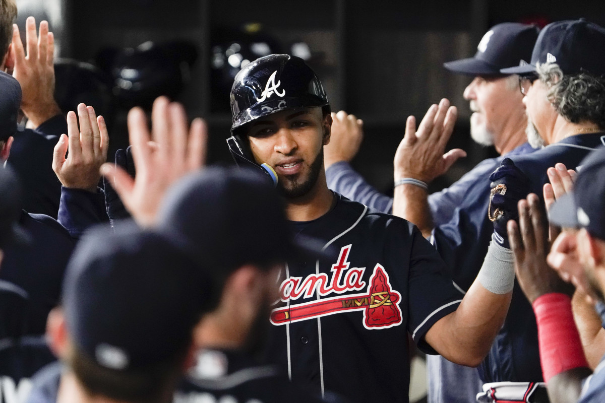 May 17, 2023; Arlington, Texas, USA; Atlanta Braves left fielder Eddie Rosario (8) is greet in the dugout after hitting a two-run home run during the second inning against the Texas Rangers at Globe Life Field. Mandatory Credit: Raymond Carlin III-USA TODAY Sports
