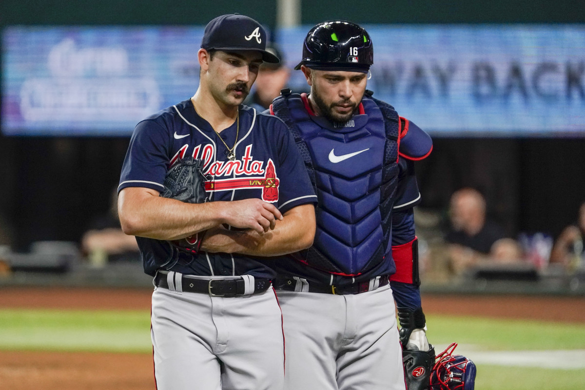 May 17, 2023; Arlington, Texas, USA; Atlanta Braves starting pitcher Spencer Strider (99) and catcher Travis d'Arnaud (16) talk on the way to the dugout after the third inning against the Texas Rangers at Globe Life Field. Mandatory Credit: Raymond Carlin III-USA TODAY Sports