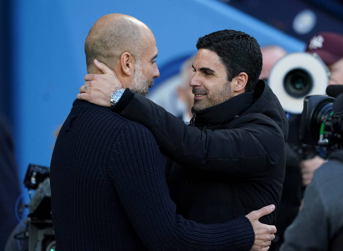 Manchester City manager Pep Guardiola (left) and Arsenal boss Mikel Arteta pictured embracing before a Premier League game in April 2023
