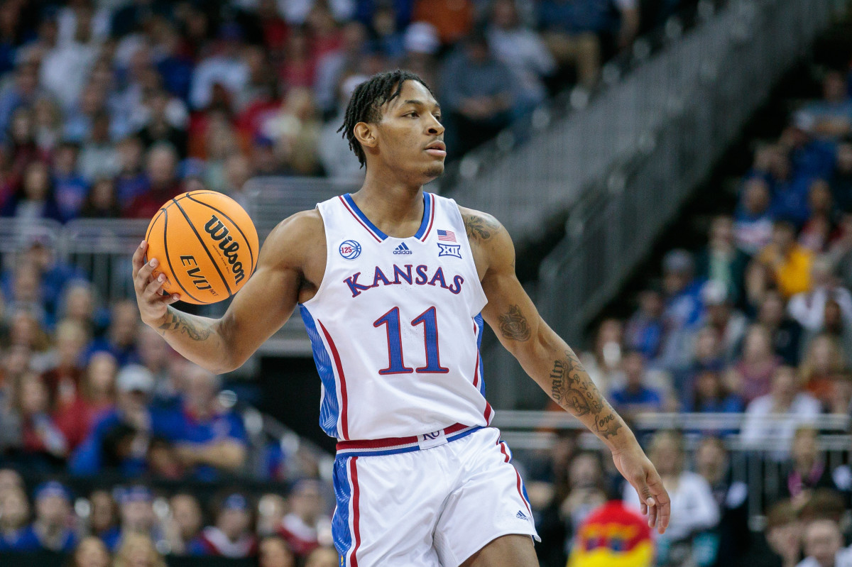 Mar 11, 2023; Kansas City, MO, USA; Kansas Jayhawks guard MJ Rice (11) sets the play during the first half against the Texas Longhornsat T-Mobile Center. Mandatory Credit: William Purnell-USA TODAY Sports