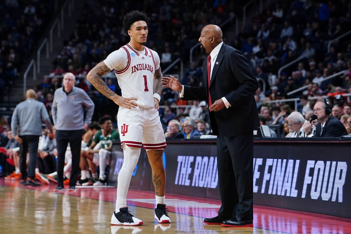 Mar 19, 2023; Albany, NY, USA; Indiana Hoosiers guard Jalen Hood-Schifino (1) talks with head coach Mike Woodson during the second half at MVP Arena.
