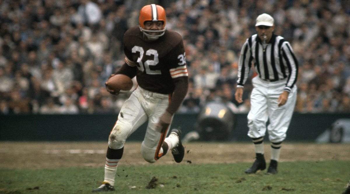Jim Brown runs with the football.