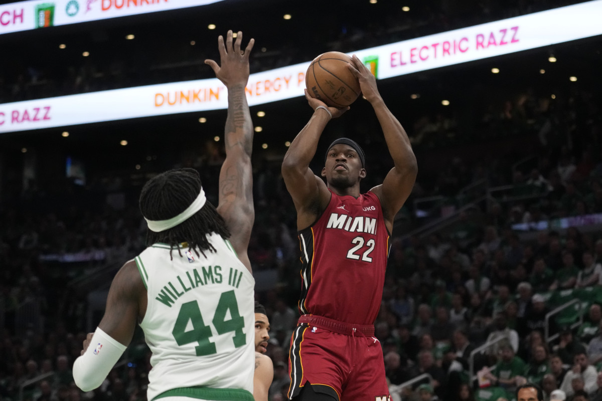 Jimmy Butler shoots against Boston Celtics center Robert Williams III in the first half.